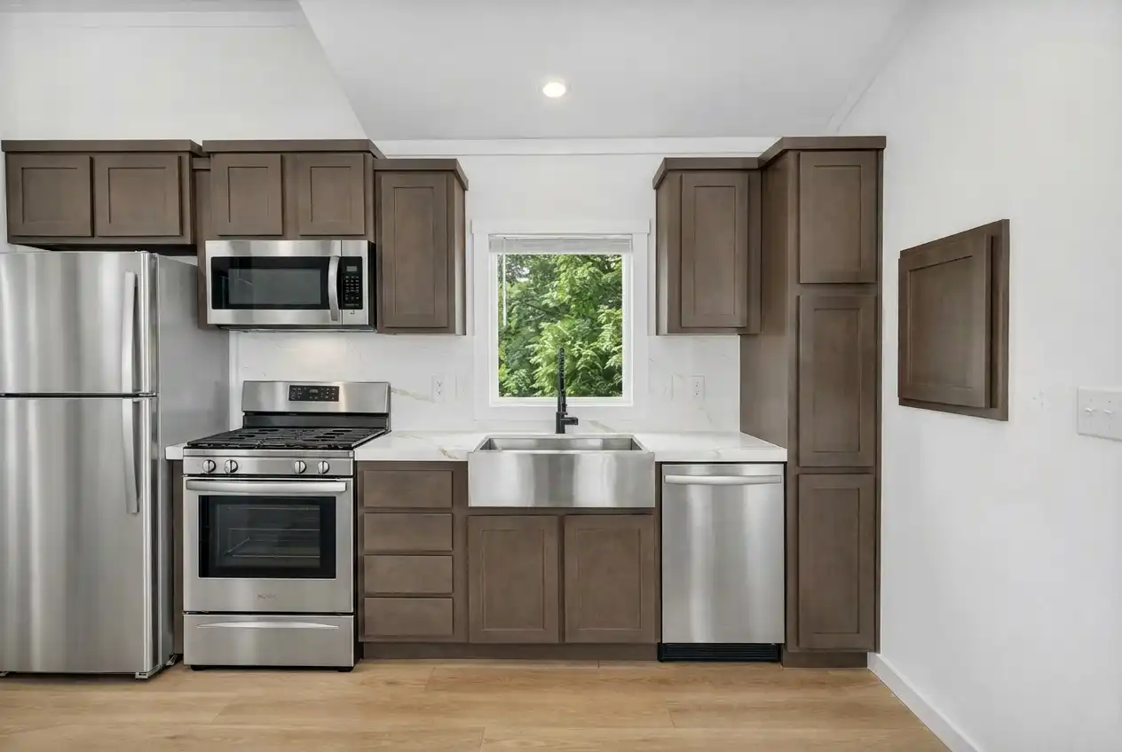 The Loft - kitchen with stainless appliances and farmhouse sink