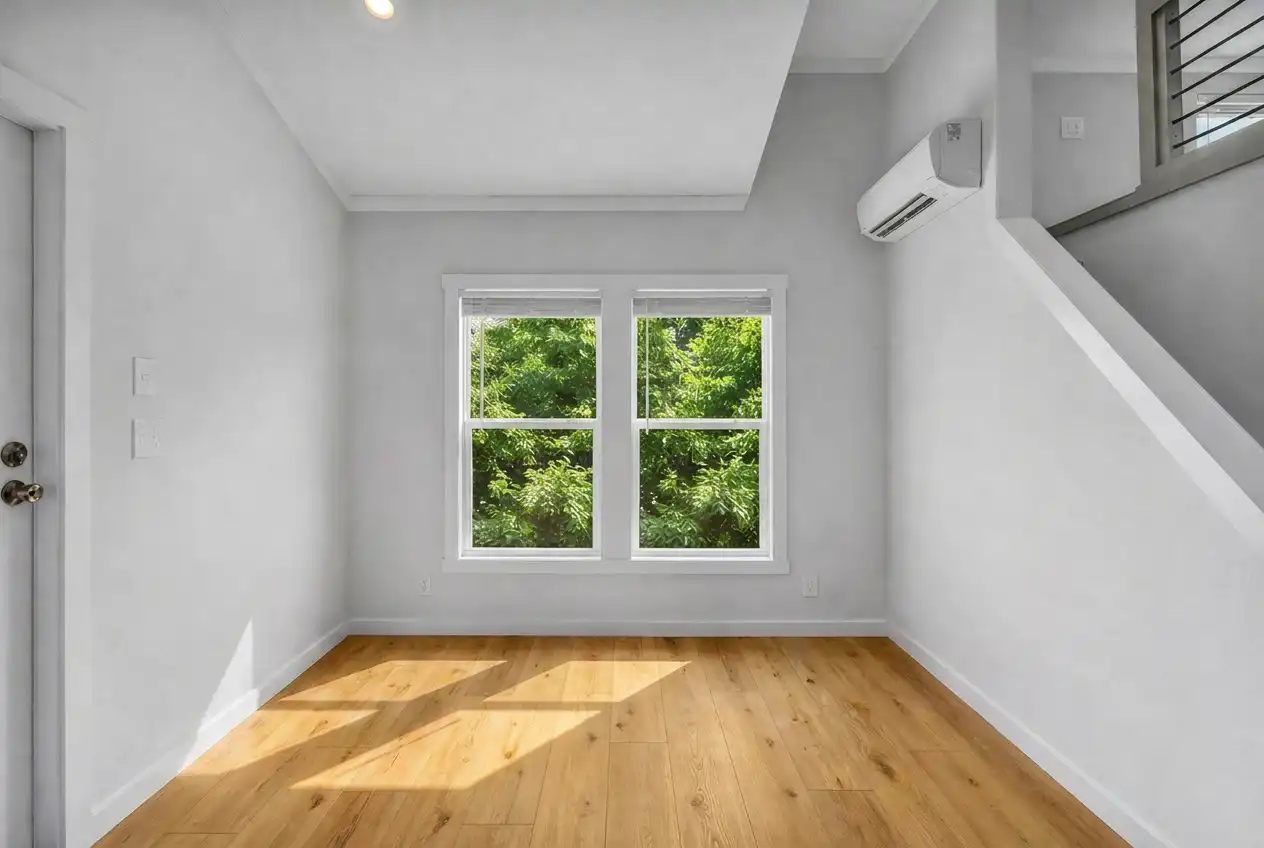 The Loft - living area with vaulted ceiling and loft stairs