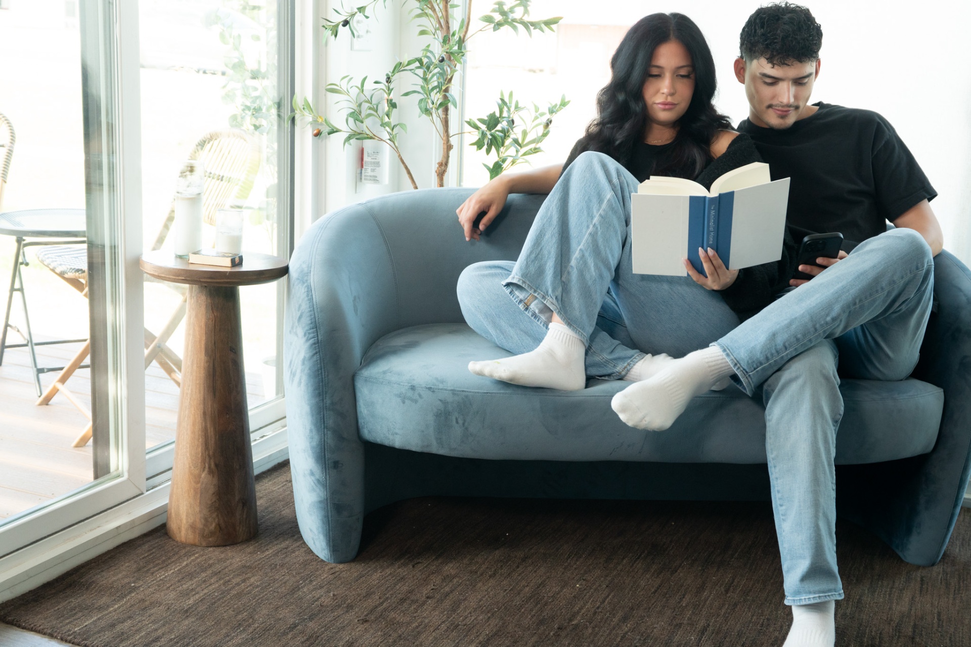 Couple reading together in comfortable MDU living space