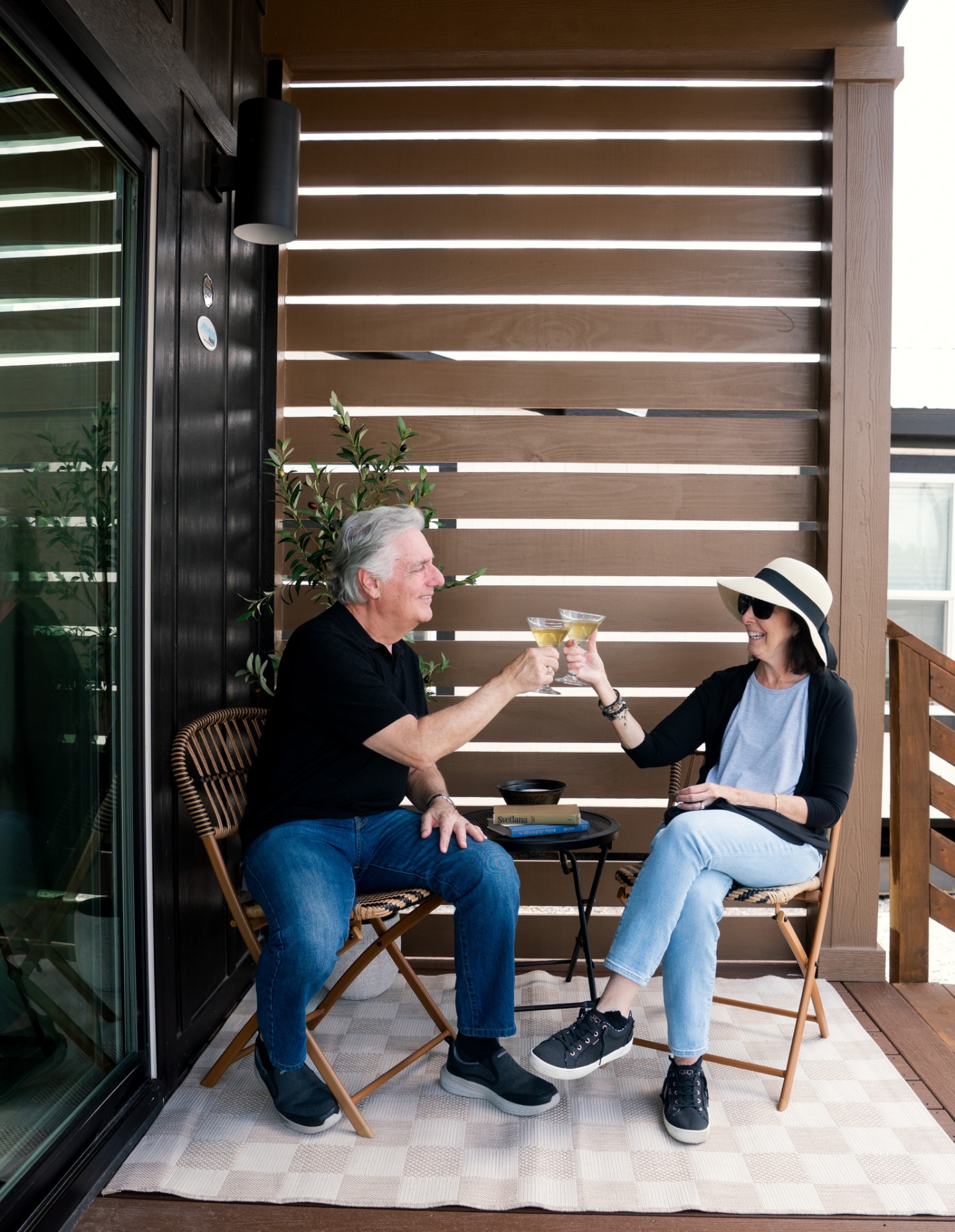 Couple toasting on porch
