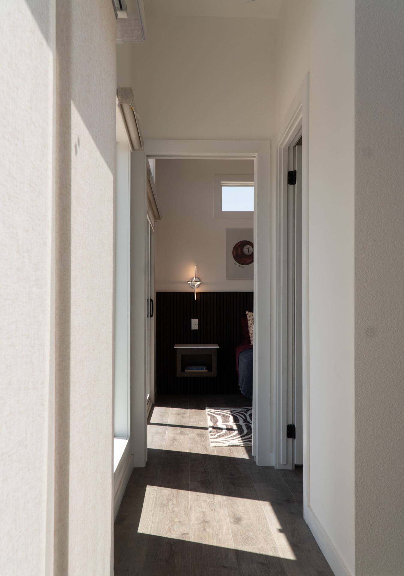 Sunlit hallway to bedroom