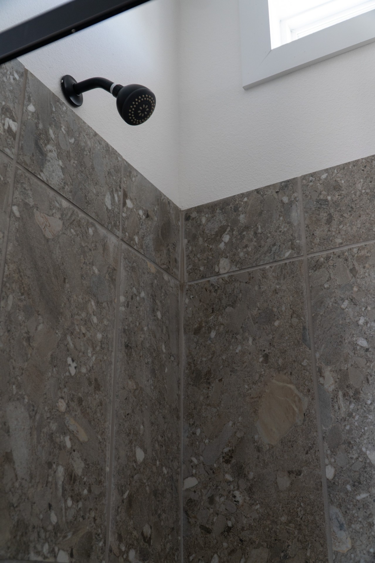 Stone tile shower corner