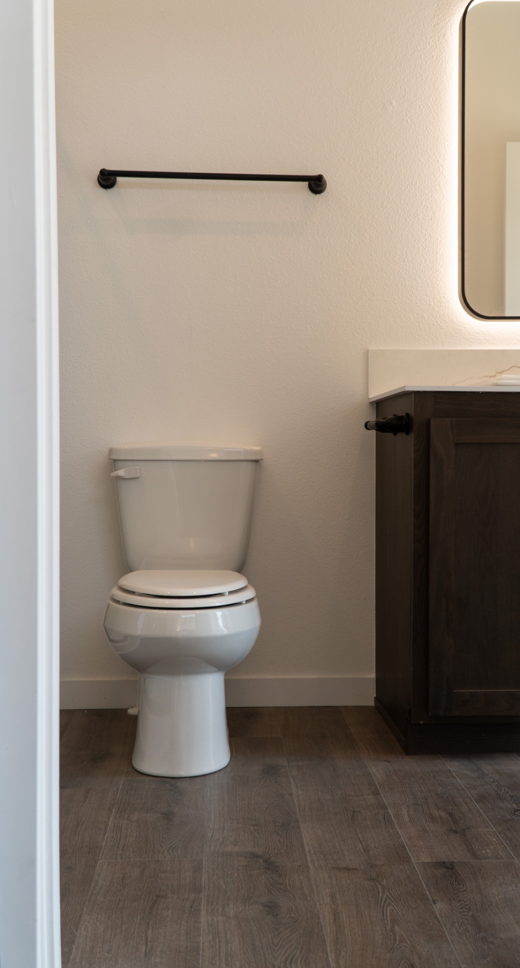 Bathroom with towel bar and vanity