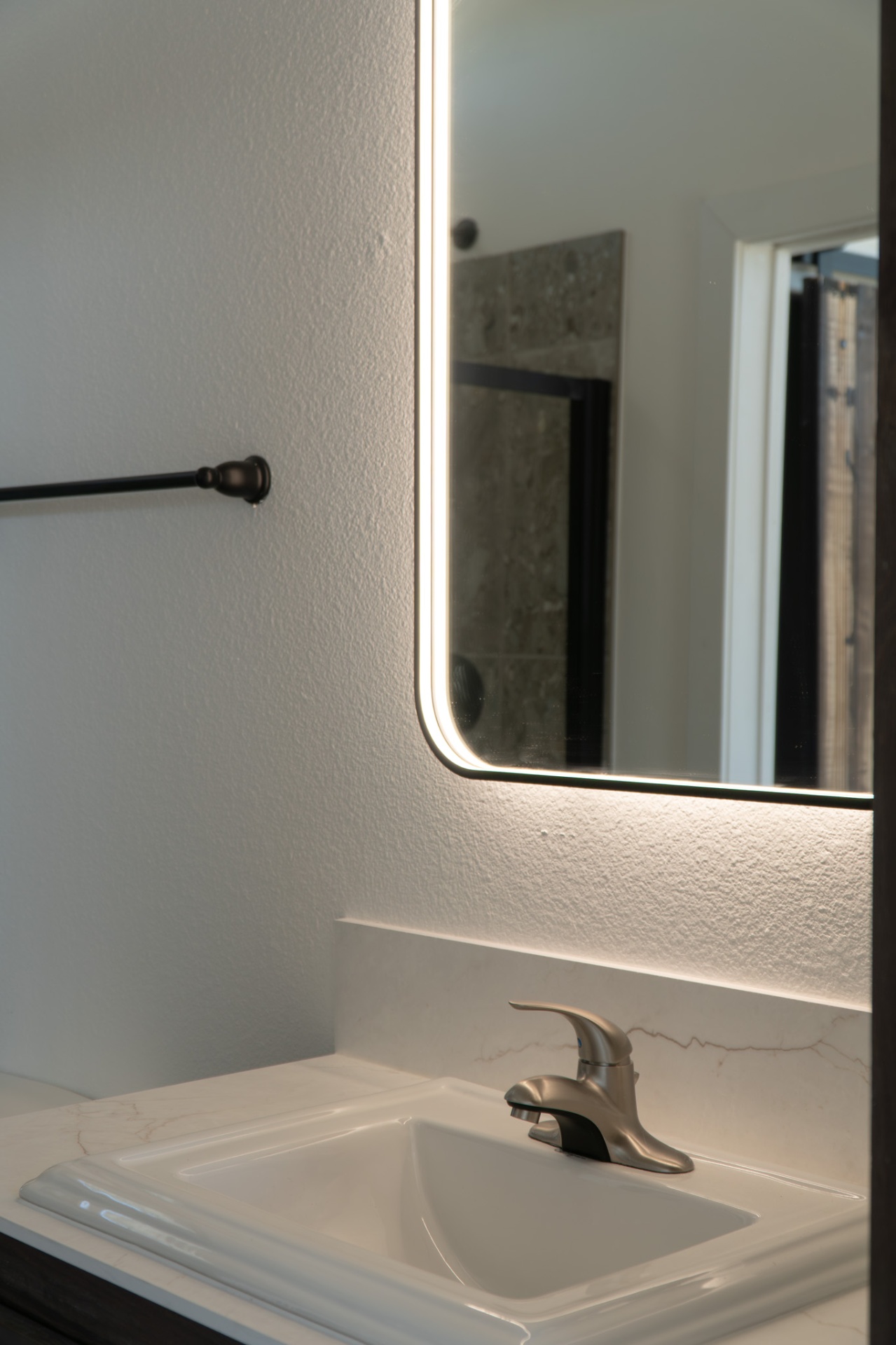 Backlit mirror and sink detail