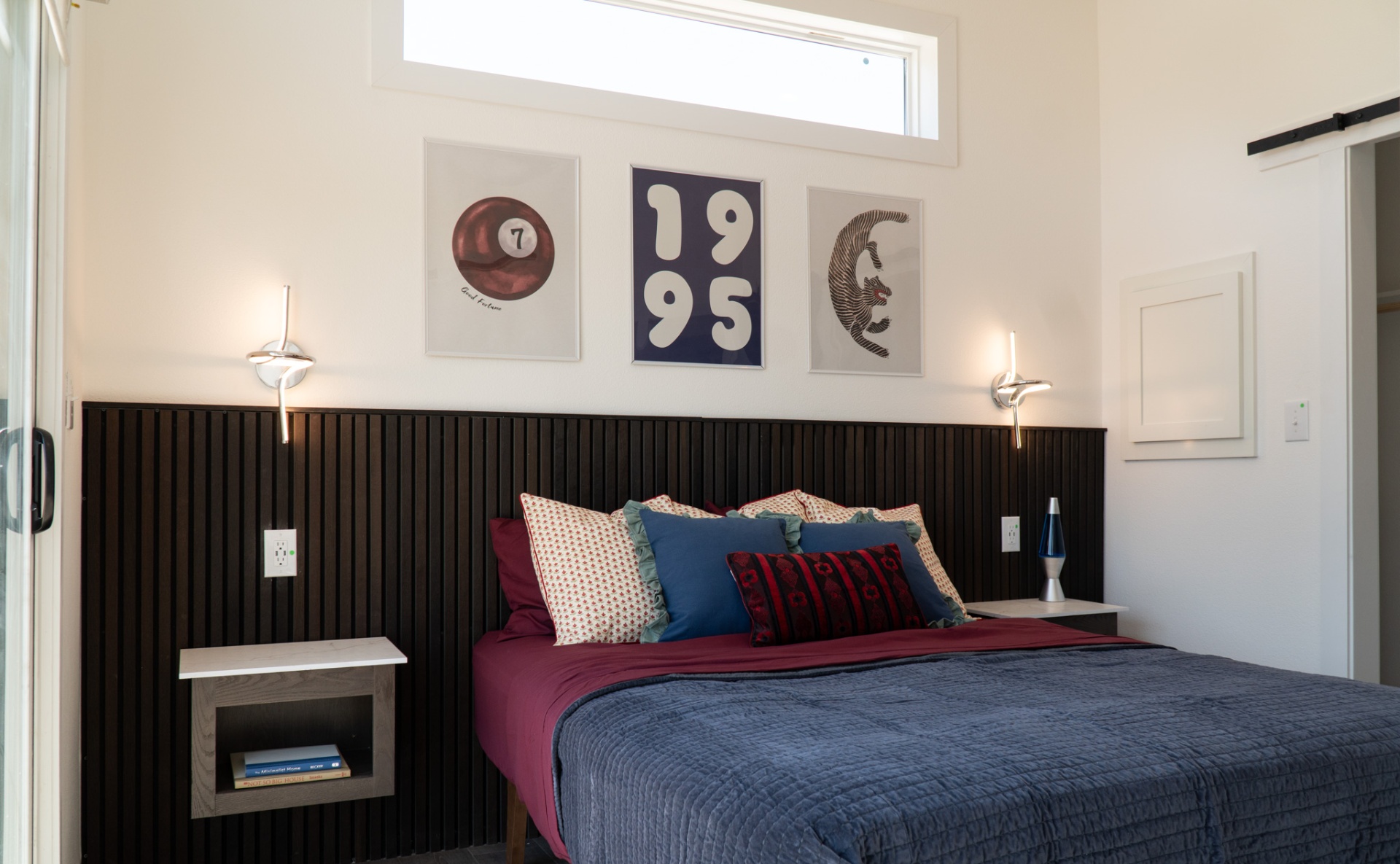 Full bedroom with skylight and art